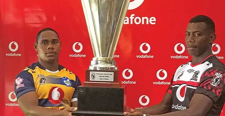 Ratu Kadavulevu School Eels Under-19 captain Sylvester Tamaicakai (left) and Naitasiri Secondary School’s Senivalati Vunibola with the Under-19 trophy at the Vodafone headquarters in Tamavua, Suva on May 4, 2023. Photo: Sereana Salalo
