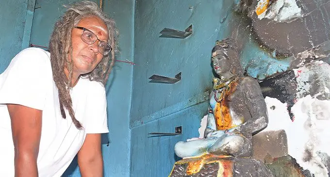 Sri Shiva Subramaniya temple pujari and caretaker, Sangeeta Reddy, with the partially burnt Lord Shiva statue at Naitata Navua on April 13, 2024. Photo: Ronald Kumar