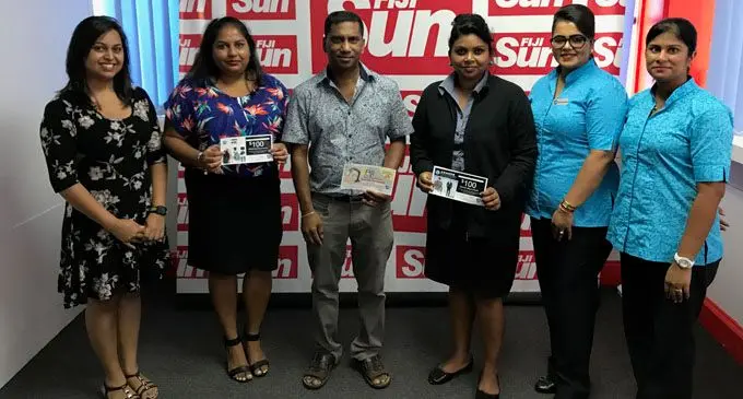 Valentines Promo winners Second from left Bandhana Vikashni Sharma, Rajnesh Ravindra and Shradha Dutt at the Fiji Sun head office during the handover of the vouchers on March 1st 2018. Photo: Roneel Karthik