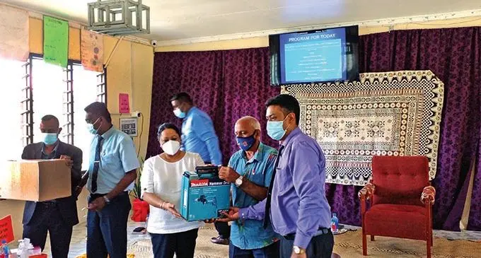 The Minister for Education,Heritage and Arts Premila Kumar hands over the PPE resources and agriculture school tools  from the Korean Embassy to  the  management of Balata College in Tavua yesterday. Photo: Salote Qalubau