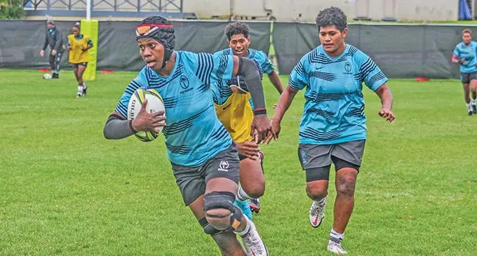Rooster Chicken Fijiana XVs lock Reijeli Daveua (with ball) during training as she is followed by Joma Rubuti and Ana Maria Naimasi in Auckland, New Zealand, on October 12, 2022. Photo: FRU Media