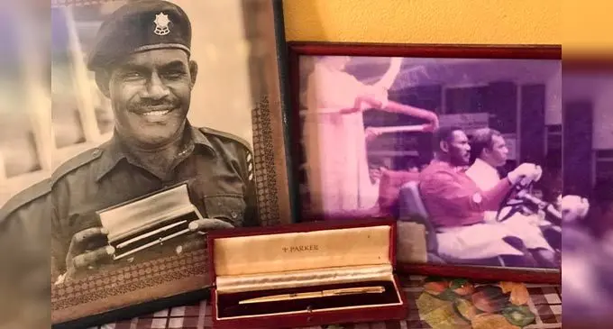 A picture of the late WO1 Jone Sokovata holding the parker pen, a picture of WO1 Jone Sokovata driving the Queen in Lautoka and the gift at the Sokovata family home in Suva on September 14, 2022. Photo: Inoke Rabonu