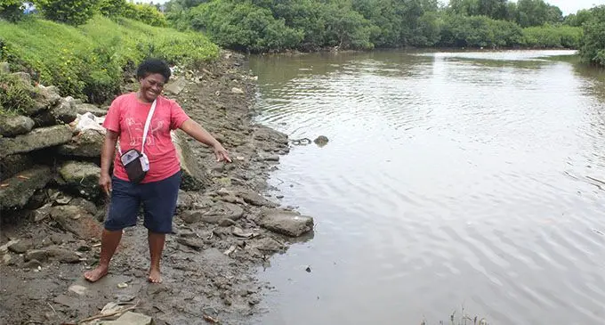 A Nokonoko resident points to where the dead hammerhead baby sharks were found. Photo: Simione Haravanua