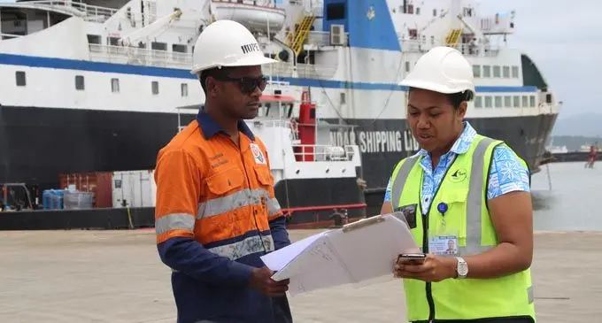Nanise Kabakoro (right) discuses an issue with a collegue during one of her assesments at the Mua-i-walu port in Suva