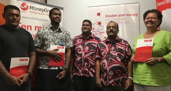 From left: Winners Denaia Naigulevu, Neumi Tabuyaqona, MH Money Express manager currency exchange Daniel Chand, general manager Alok Mishra and Sandra Poulter. Photo: Sheldon Chanel