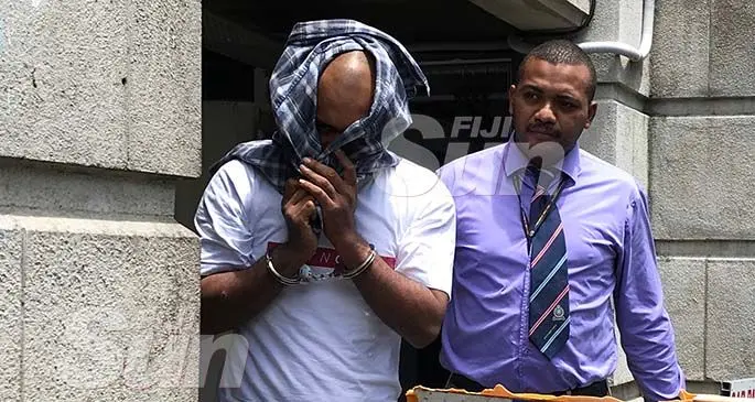 Yavala Baravilala escorted by a Police Officer outside the Magistrate court in Suva on January 8, 2020. Photo: Ashna Kumar