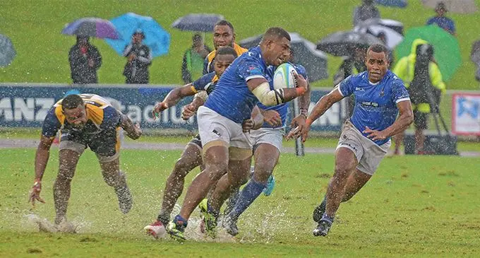 Police Blue playmaker Livai Ikanikoda (right) comes in to support Joni Tanoa in the Cup semi-final against Ratu Filise of the Fiji Bitter Marist 7s on March 23, 2019. Police won 20-12 . Photo: Ronald Kumar .