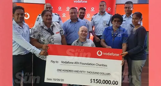 From left: Rotary Pacific Water For Life Foundation executive offer Neil Maharaj, Selita Saula of Hakwa Foundation, Vodafone Fiji acting chief executive officer Ronald Prasad, Joshco Wakaniyasi of Spinal Injury Association Fiji, Sainimere Rakula and Priyanka Prasad from the Foundation for Education of Needy Children, surrounded by Police officers during the cheque handover on September 10, 2020. Photo: Lusiana Tuimaisala.