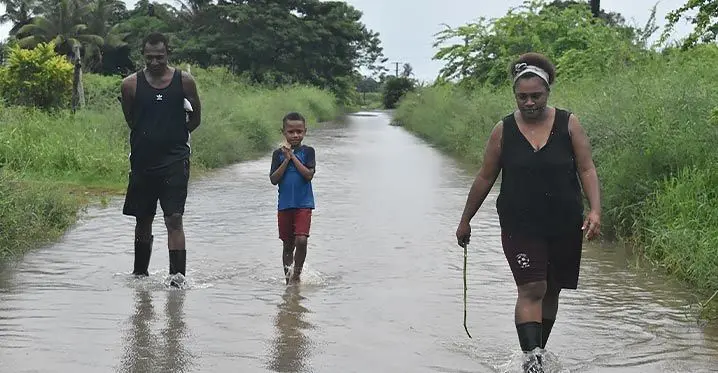 Susi Tinakula (right) with her husband, Turuva and their son, Inia at a flooded Maqalevu in Nadi. Photo: Mereleki Nai