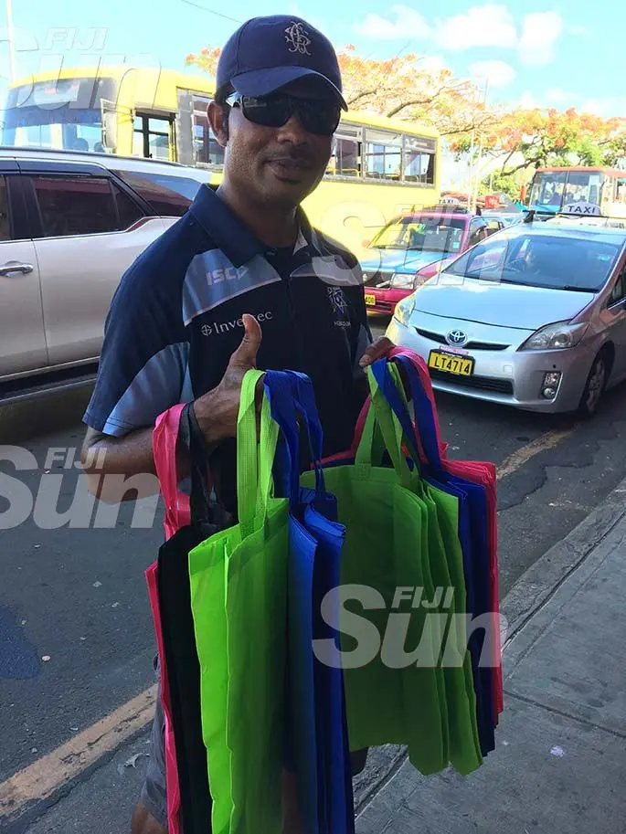Peniasi Ravuna selling carry bags in Suva. Photo: Renu Radhika