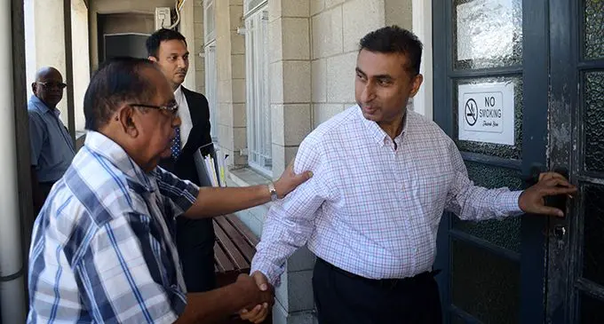 Rohit Ram Latchan (right) outside Court on February 11, 2020.  Photo: Ronald Kumar 