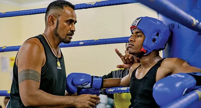Caubati Boxing Club trainer Kaiafa Ledua attends to Vetaia Naisoro as amateur boxing in Suva resumes this Saturday. Photo: Boxing Fiji