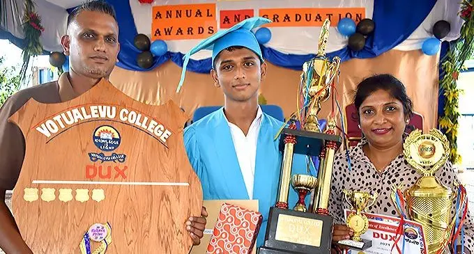Aaron Prasad is flanked by his parents, Arunesh Amang Prasad and Shaleen Prasad with the spoils. Photo: Waisea Nasokia