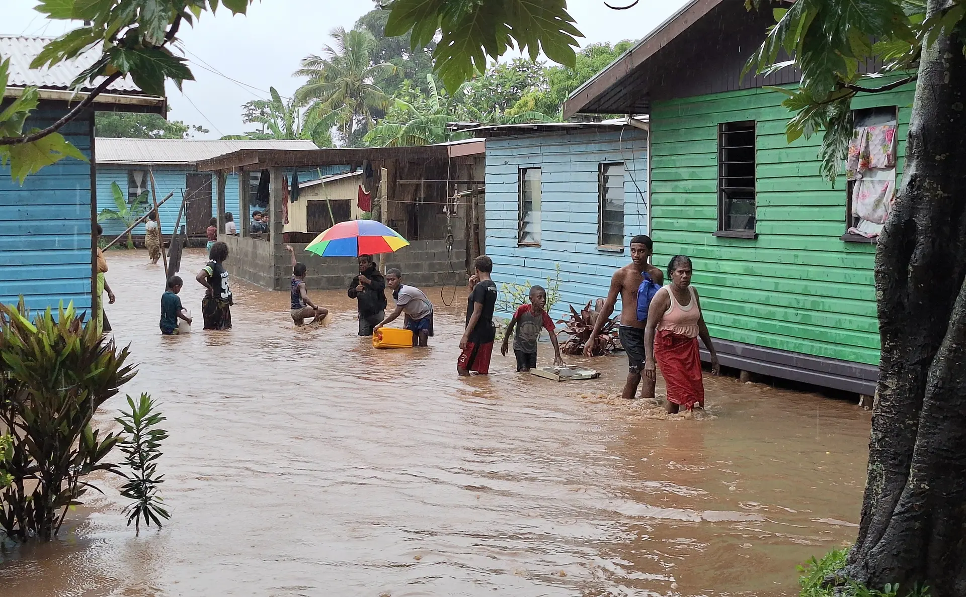 Matawalu villagers evacuating the village and going on the roadside as flood waters submerged the village. 