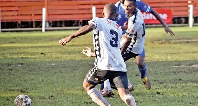 Suva’s Meli Codro (3) assists Sairusi Nalaubu during their Group A clash against Lautoka at Subrail Park, Labasa, on November 26, 2020. Photo: Sereana Salalo