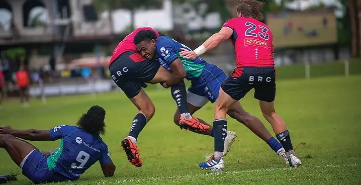 Swire Shipping Fijian Drua centre Iosefo Masi tackles a Melbourne Rebels player during their Super Rugby pre-season trial match at Prince Charles Park, Nadi on January 28, 2023. Photo: Leon Lord.