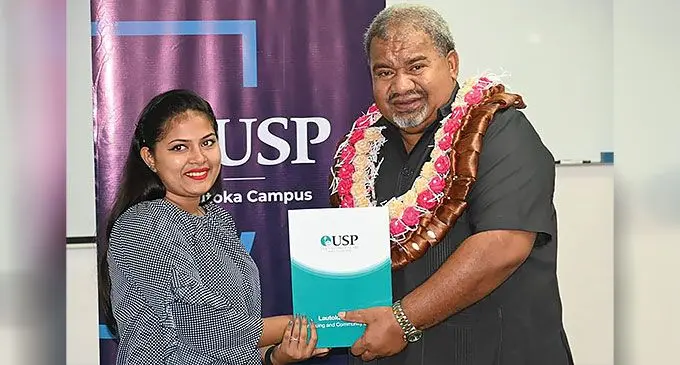 Simran Silvia Kumari receives her certificate from the Minister for Youth and Sports Jese Saukuru during the graduation ceremony at the University of the South Pacific Lautoka Campus on June 25, 2024. Photo: Fijian Government