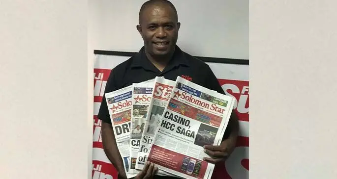 Fiji Sun senior circulation officer Eroni Rokoyamaca holds copies of the national daily newspaper of the Solomon Islands, the Solomon Star. Photo: Maraia Vula.