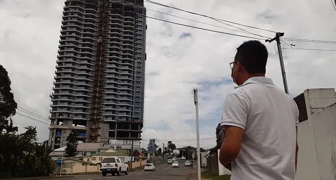 Kevin Hon looking at the WG Friendship Plaza in Suva. A piece of cement block fell near his car on Wednesday morning Photo: Shalveen Chand 