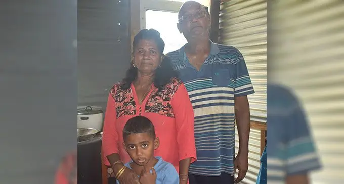 Jagendra Nath with his wife Maitra Devi and grandson Jashneel Jason Pillay at their makeshift home in Martintar,Nadi on October 24,2022. Photo: Salote Qalubau
