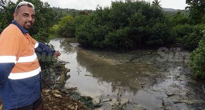 Roneel Lal of COPE Construction shows the factory waste pumped out at the creek in Lami on September 9, 2020. Photo: Ronald Kumar