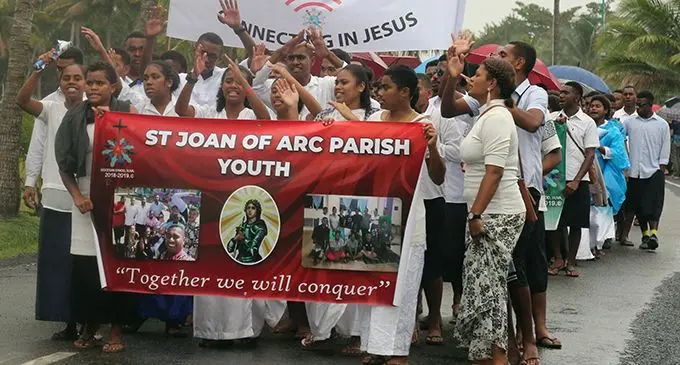 Members of the St Joan of Arc Parish Youth marching and Archbishop Peter Loy Chong to mark the Echaristic Celebration Synod Launch on June 30,2019.   Photo: Simione Haravanua