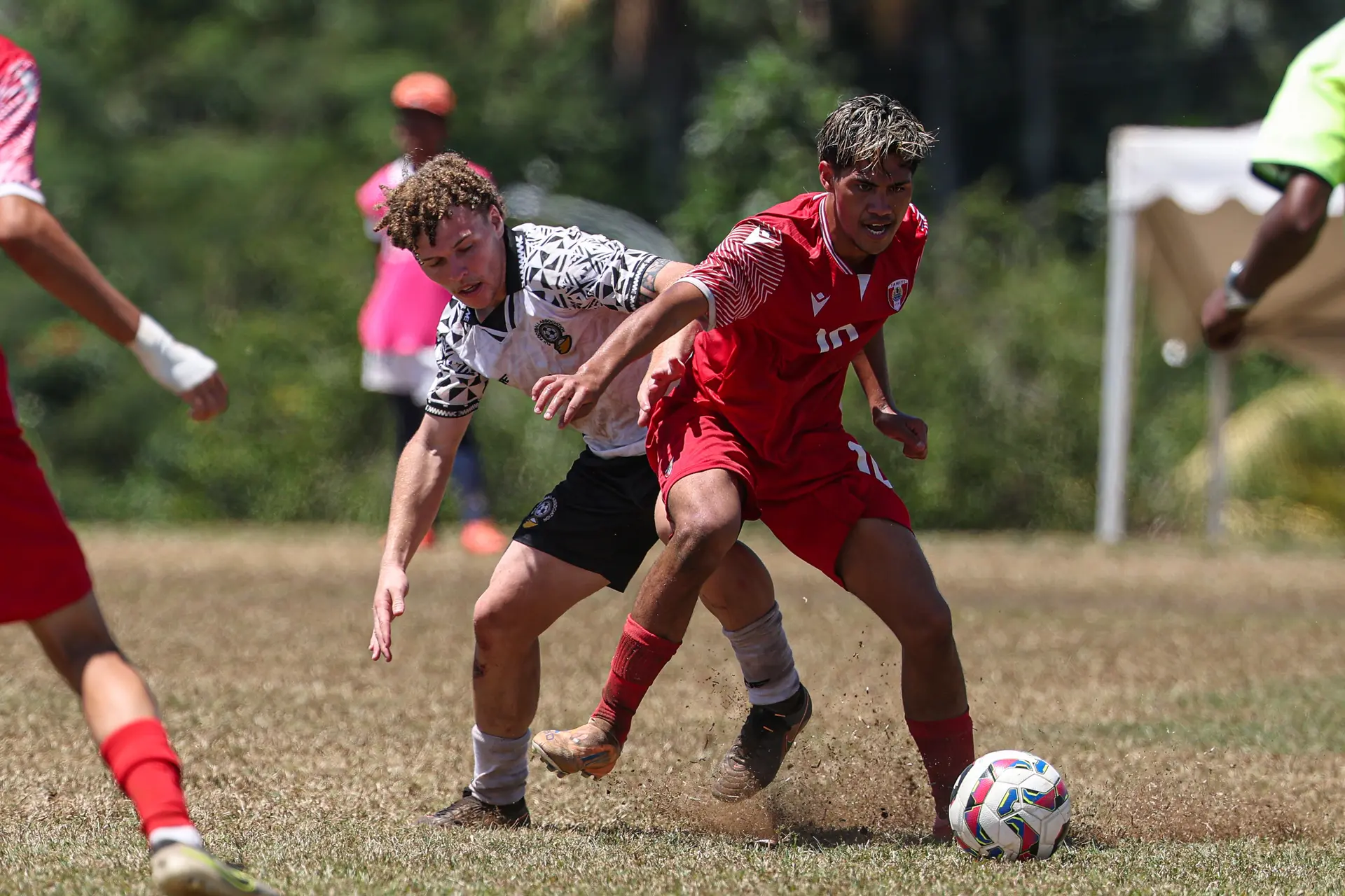 Fiji Under-19 midfielder Nicholas Franklin tussles for the ball against Tahiti. 