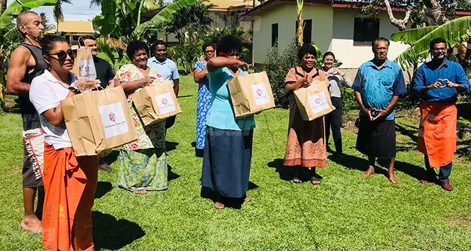 Multi Property Vice President, Fiji & Samoa – Marriott International and General Manager - Sheraton & Westin Resorts, Fiji, Neeraj Chadha, (right) with hotel executives and villagers of Narewa with some food packs on April 30, 2020. Photo: Charles Chambers