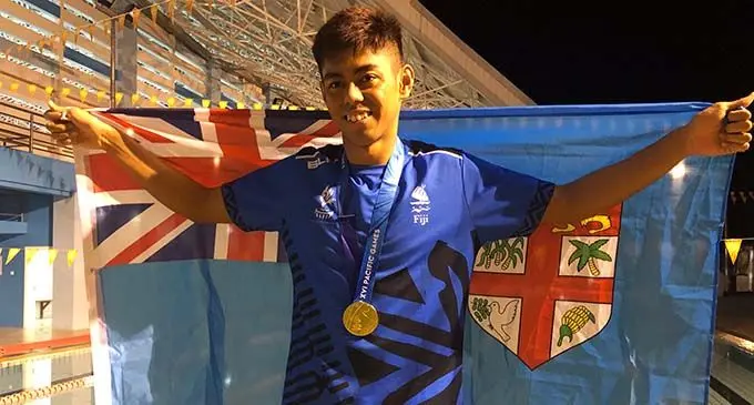 Swimmer Taichi Vakasama with his gold medal in Apia, Samoa on July 9, 2019.  Photo: Rosi Doviverata 