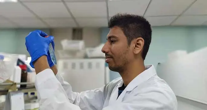 Ashmit Kumar working in the lab.