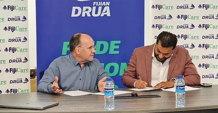 Swire Shipping Fijian Drua chief executive officer Mark Evans (left) FijiCare executive director, Avi Raju during the sponsorship signing at the Drua’s Legalega home base in Nadi on February 21, 2023. Photo: Fijian Drua Media