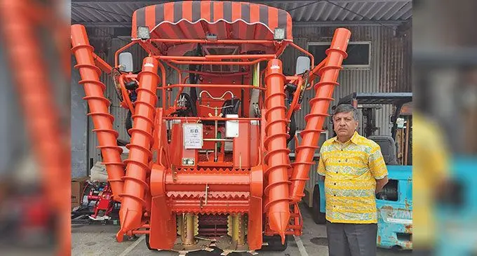 Minister for Sugar and Multi-Ethnic Affairs, Charan Jeath Singh, with the hilly terrain sugarcane harvester in Japan, which will be transported to Fiji soon.