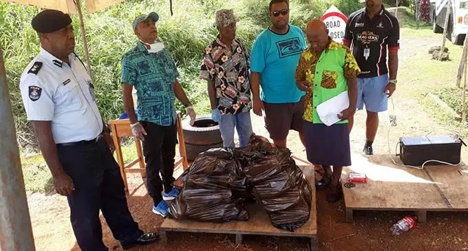 Divisional Manager Community Policing North Assistant Superintendent of Police Ulaiasi Talebula (left), sorting out groceries with Seaqaqa Shopping Centre director Hasim Khan at Soasoa in Labasa on April 10, 2020. 