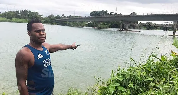 Viliame Sauduadua on May 17, 2020, pointing at the spot where he rescued a man who jumped off the Rewa Bridge in Nausori last Saturday. Photo: Kelera Sovasiga