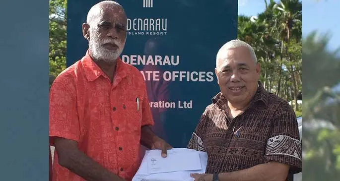 From left: Tui Nadi, Ratu Vuniani Dawai, receives food vouchers from Denarau Corporation Limited general manager Nesbitt Hazelman. Photo: Charles Chambers