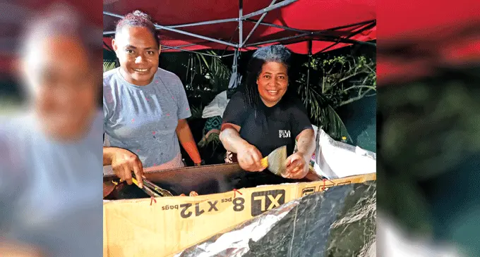 Motu Lalagavesi, 40, with friend, Melisa Ligaqaqa, 34, preparing BBQ meals at the roadside stall in Covata Housing, Tuatua Labasa on November 10, 2022. Photo: Sampras Anand