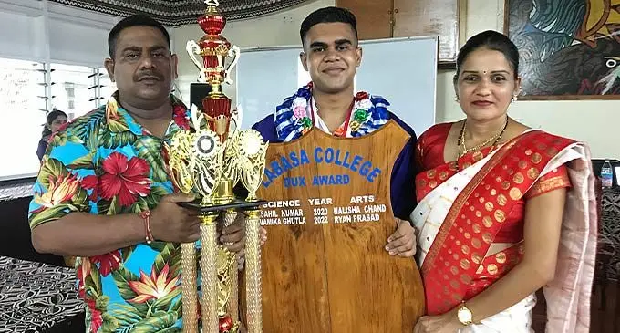 Ryan Prasad(middle) with his parents Hemandra Prasad and Neelam Mala during the prize giving ceremony in Labasa on December 9, 2022 Photo: Shratika Naidu
