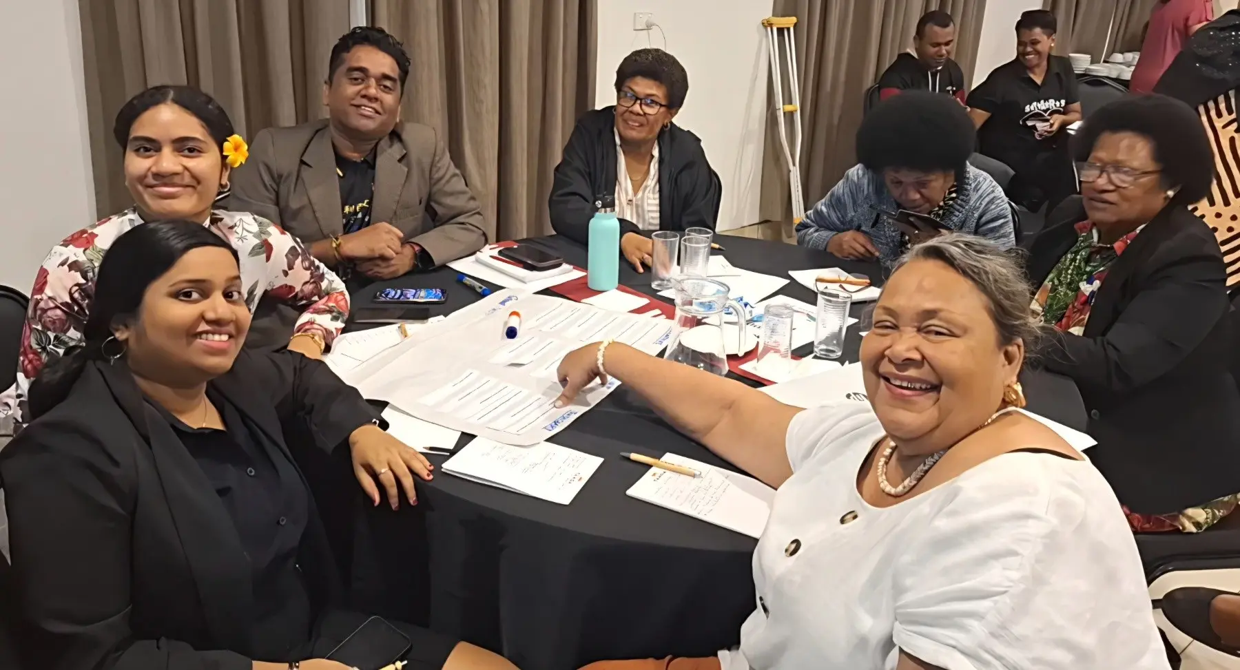 Ilisapeci Tamani. Law student and Blesson Real Estate Fiji realtor Khusbu Raj (left) with the participants at the Women in Politics and Leadership Forum