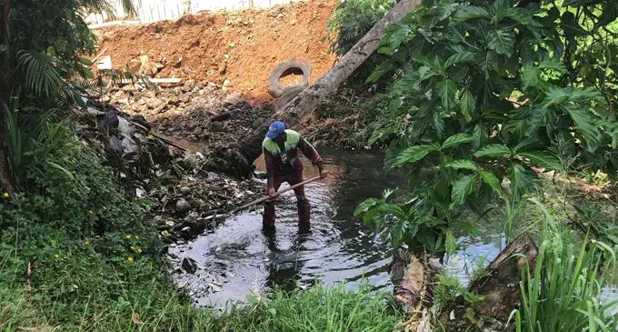 Nasinu Town Council worker cleaning the drain at Church Street, Nadera. Photo: Selita Bolanavanua