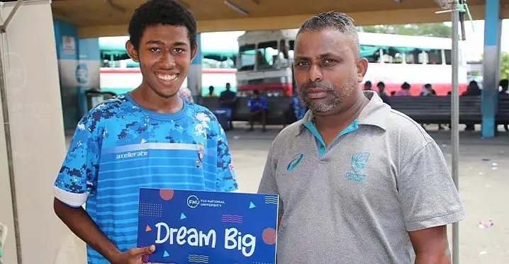 From right: A.D. Patel College teacher Vishwa Achari with Mosese Poe to enroll at the Fiji National University’s (FNU) Enrolment Roadshow at the Ba Bus Stand last weekend.