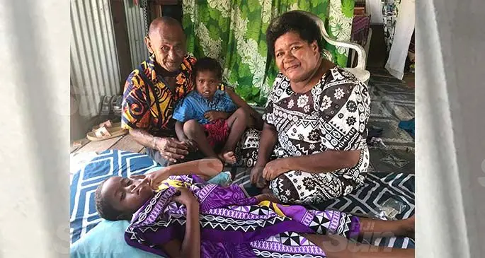 Autanaisa Usa and Aminio Bale with their circumcised grandson Aminio Ligavatu, 7, and Sefanaia Ligavatu, 5, at their home in Taira Village on Vanuavatu Island on February 17, 2021. Photo: Inoke Rabonu