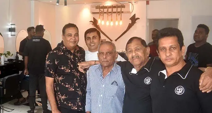 Staff members of Hero Barber shop in Nadi.