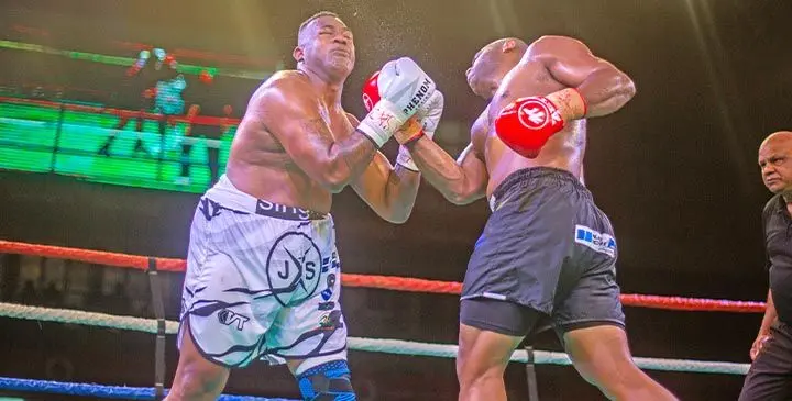 Semi Dauloloma (right) lands an uppercut on James Singh (left) during their title fight at the Vodafone Arena, Suva on July 19, 2025. Photo: Josua Buredua