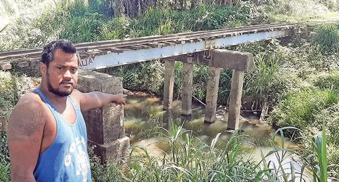 Tony Tiare points at the creek underneath the Natabua tramline in Lautoka where he found the young man’s body on September 26,2021. Photo: Salote Qalubau