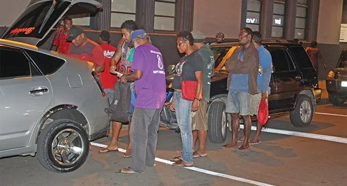 The homeless help themselves to dinner which is prepared by Jese Tuilaucala in Suva on March 15, 2019. Photo: WATI TALEBULA