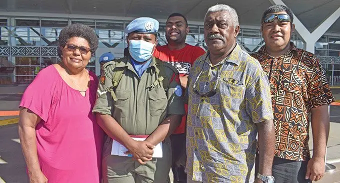 Lance Corporal Avisake Salauca(second from left) with family members at the Nadi International Airport. Photo: Mereleki Nai