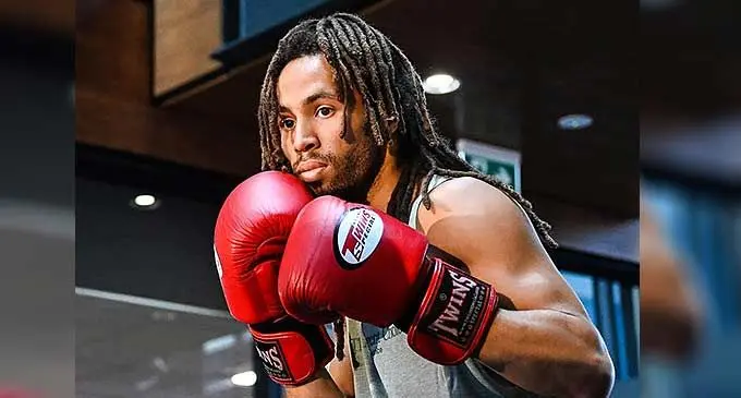Zain Adams of Peach Boxing in New Zealand runs to the neutral corner after knocking Patthaphi Camton out cold in the second round of their fight on December 2, 2023.
