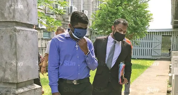 Police Constable Adrian Joseph Mangru with his lawyer outside the Magistrates Court in Suva on November 11, 2021. Photo: Ashna Kumar