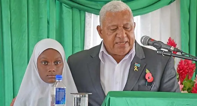 Year 6 student Afrah Nazim with PM at Nadi Muslim School. Photo: Office of the Prime Minister