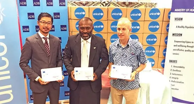 From left: Asian Development Bank’s (ADB) Pacific Subregional Office Masayuki Tachiiri, Minister for Health and Medical Services Dr Ifereimi Waqainabete and UNICEF Pacific Island Representative Sheldon Yett during the GeneXpert test kits handover on March 1, 2021.  Photo: Inoke Rabonu